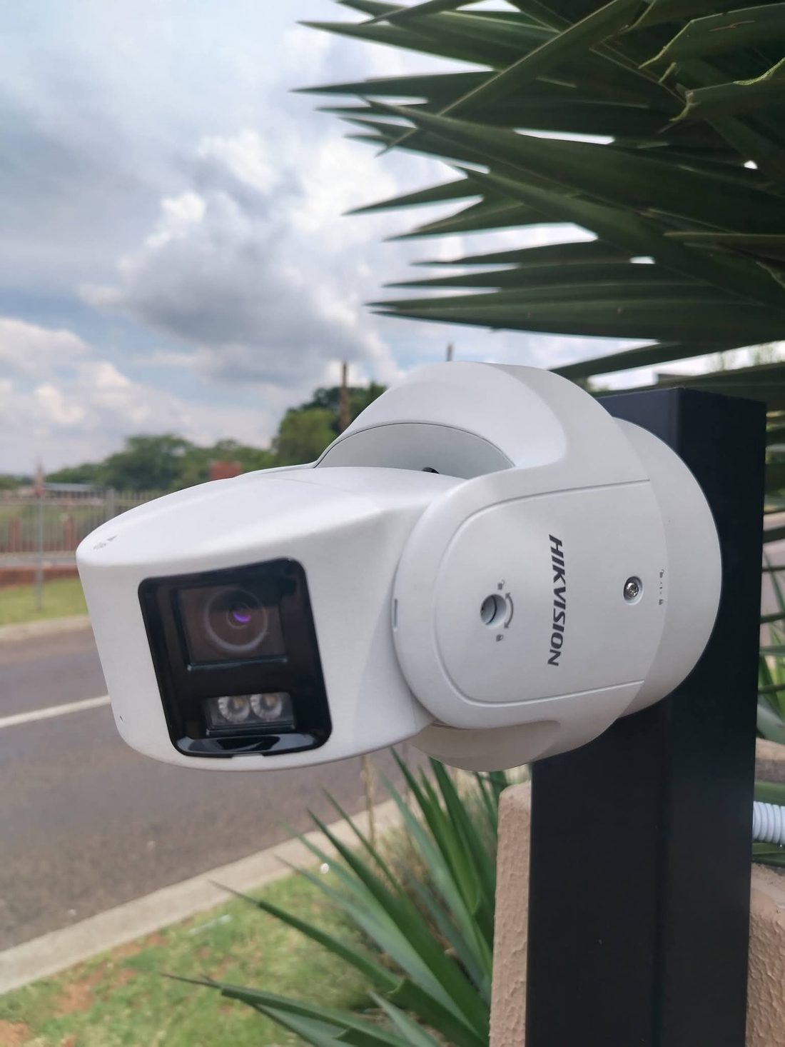 Panoramic dual-lens camera at estate entrance